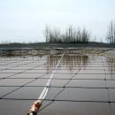 Suspended netting system for frac ponds